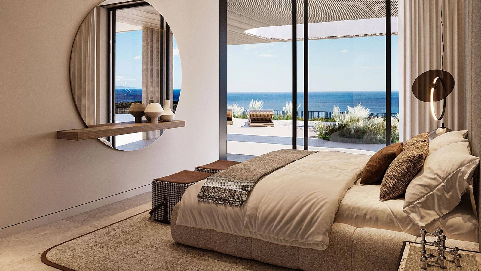 Slaapkamer met uitzicht op de oceaan in Nalu Suites